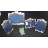 A pair of modern silver photograph frames in the Edwardian taste with embossed bow,