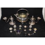 A box of assorted silver and plated wares to include a pair of Edwardian silver peppers with