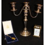 A brass cased carriage clock, a silver gilt Elizabeth II Golden Jubilee commemorative spoon,