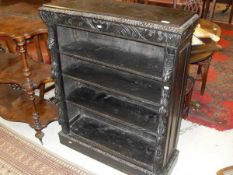 A Victorian carved oak Gothic revival bookcase,