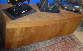 A modern teak shallow bow fronted sideboard,