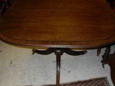 A early 20th Century mahogany D-end dining table with leaf