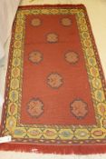 A needlework rug,