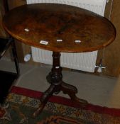 A Victorian walnut oval pedestal occasional table on tripod base,