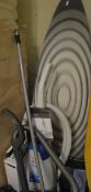 A large ironing board, together with a Vax MA & CH Rapid Power carpet washer,