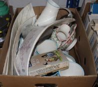 A box of sundries to include Thelwell books, painted tin jug and small vases,