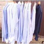 A collection of seventeen gentleman's blue and white shirts of various patterns and by various