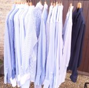 A collection of seventeen gentleman's blue and white shirts of various patterns and by various