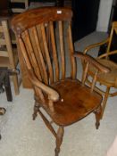 A Victorian beech and elm slat back Windsor type armchair and an elm seated smokers bow chair with