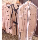 Two Burberry trench coats, one with leather trim,