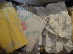 A box of assorted vintage table linen together with a black satin pyjama case,