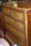 A Victorian mahogany chest of two short over three long graduated drawers with turned knob handles