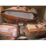 A set of Alfred Dunhill luggage comprising holdall, overnight bag and square bag,