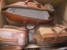A set of Alfred Dunhill luggage comprising holdall, overnight bag and square bag,