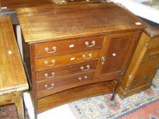 An Edwardian mahogany satinwood and cross banded music cabinet with the plain top above four fall