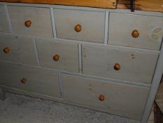 A modern John Lewis pine and stained chest of nine assorted drawers,