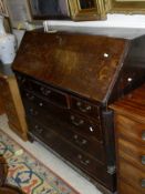 A late George III north Country oak and mahogany cross banded bureau,