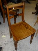 A set of six elm and fruitwood Norfolk chairs with stained detail to the bar back and slightly