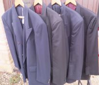 A collection of four black dress jackets,