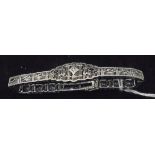 A 10 carat white gold 1920's bracelet set with diamonds and sapphires with milligrain detail all