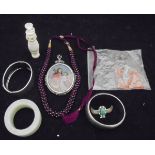 A box of assorted jewellery to include two white metal bangles,