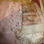 A Victorian silk shawl, the pink ground with embroidered pink, blue and cream floral motifs,