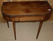 An early 19th Century mahogany and rosewood cross banded satinwood strung fold-over card table,