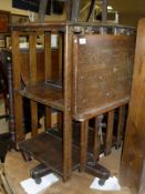 A collection of furniture comprising a late Victorian oak revolving bookcase with fold down reading
