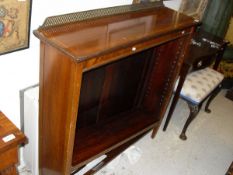 A Edwardian mahogany and satin wood banded adjustable open bookcase with lattice galleried raised
