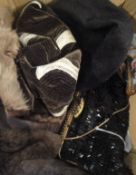 A collection of accessories to include three vintage hats, a jet bead handbag, a racoon head bag,