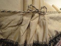 A pair of light gold ground interlined curtains,
