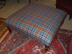 A modern check upholstered drawing room stool in the Victorian manner raised on turned stained