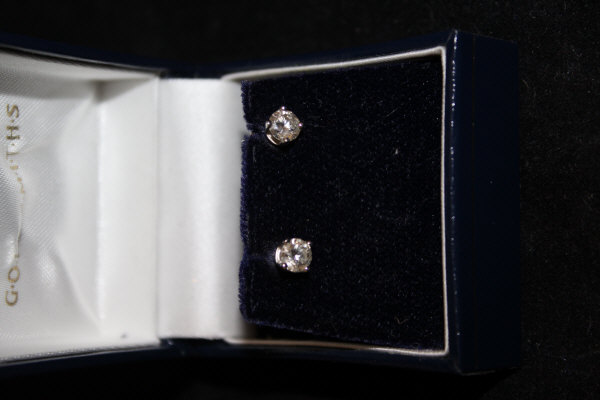A pair of 9 carat gold mounted diamond earrings