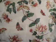 A pair of Colefax and Fowler "Honeysuckle" glazed cotton interlined curtains,