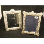 A modern silver photograph frame in the Edwardian taste with embossed C scroll and floral