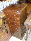 A Victorian mahogany slim chest of six drawers on a plinth base