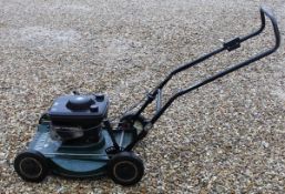 A Hayter Harrier petrol law mower with a Briggs and Stratton engine