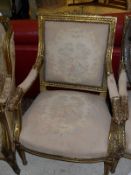 A pair of French giltwood and gesso framed salon arm chairs in the Louis XVI taste,