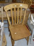 A set of four modern beech framed slat back kitchen chairs and a set of four early to mid 20th