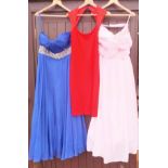 A collection of three evening dresses, one by St.