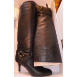A pair of Dior black knee high boots,