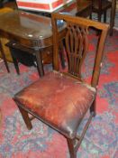 A set of eight early 19th Century mahogany framed dining chairs in the Hepplewhite manner with red