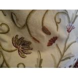 Two pairs of cotton interlined crewel work curtains with floral decoration on a cream ground