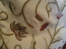 Two pairs of cotton interlined crewel work curtains with floral decoration on a cream ground