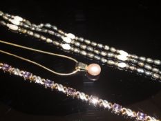 A 9 carat gold and stone set bracelet,