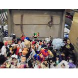 A suitcase of various costume dolls and a small bag of costume jewellery CONDITION