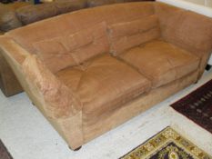 A terracotta ground three seater sofa