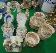 A 19th Century Continental set of six tea cups and saucers with pink banding and hand painted