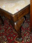 A mahogany dressing table stool with needlework seat,