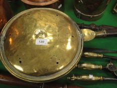 An 18th Century brass bed pan with pierced and engraved decoration bearing indistinct maker's stamp,
